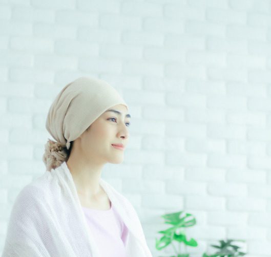 Asian woman turbaning her head. The girl is sick with a bad disease.Do not focus on the object.